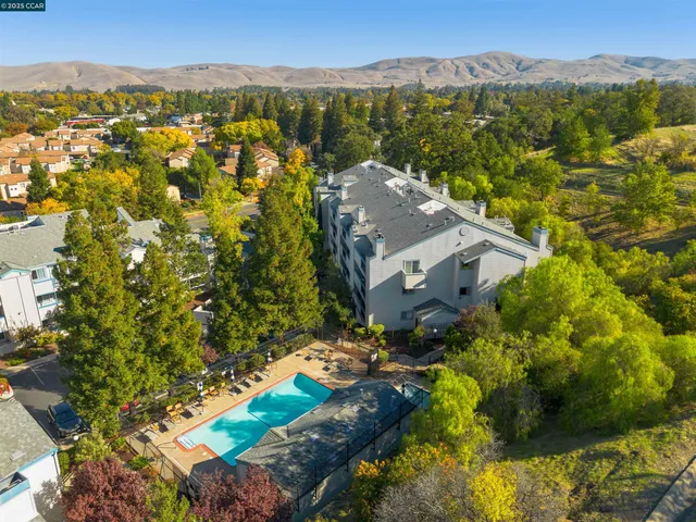 a view of a city with mountains in the background