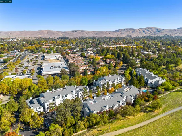 a view of a city with mountains in the background