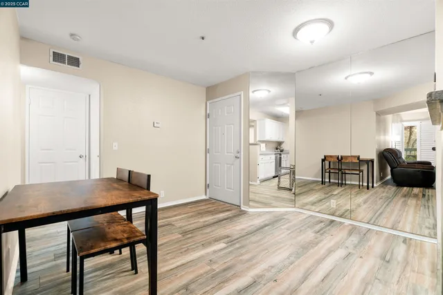 a view of a livingroom with furniture and wooden floor