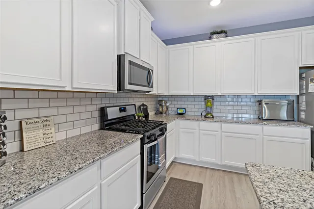 a view of a dining room with furniture and a window