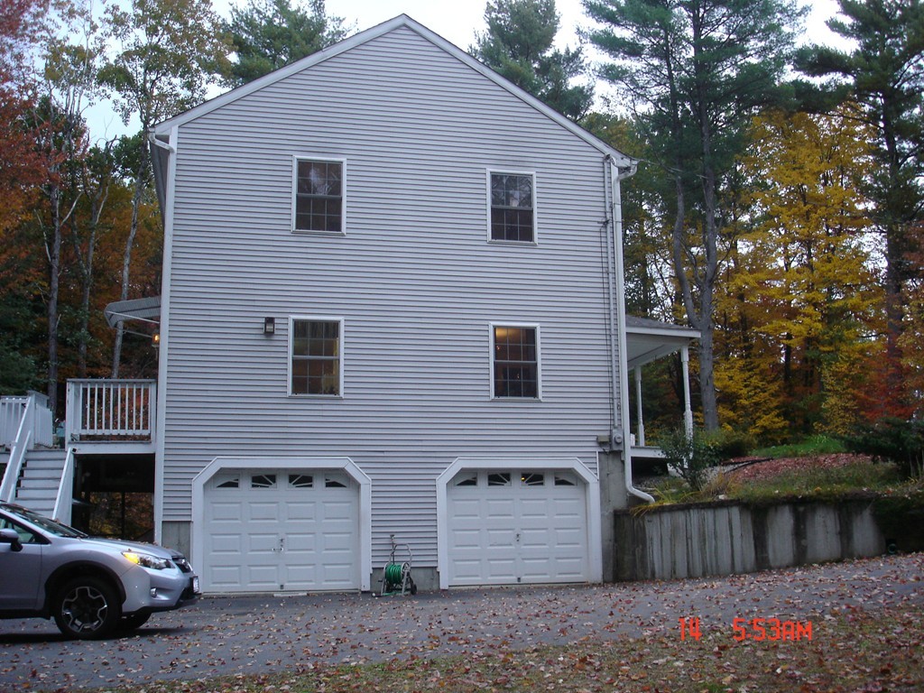 30 Bluefield Road Ashburnham, MA 01430 - Photo 25 of 30 a view of a house with a yard and wooden fence