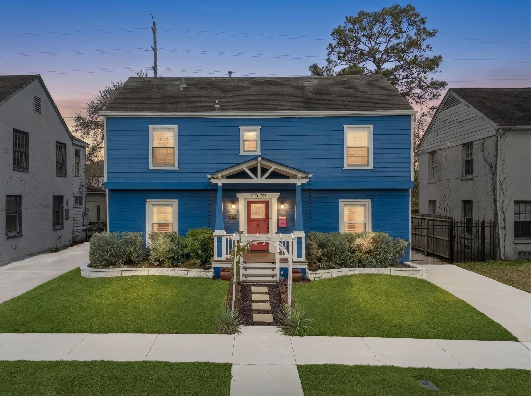 a front view of a house with a yard