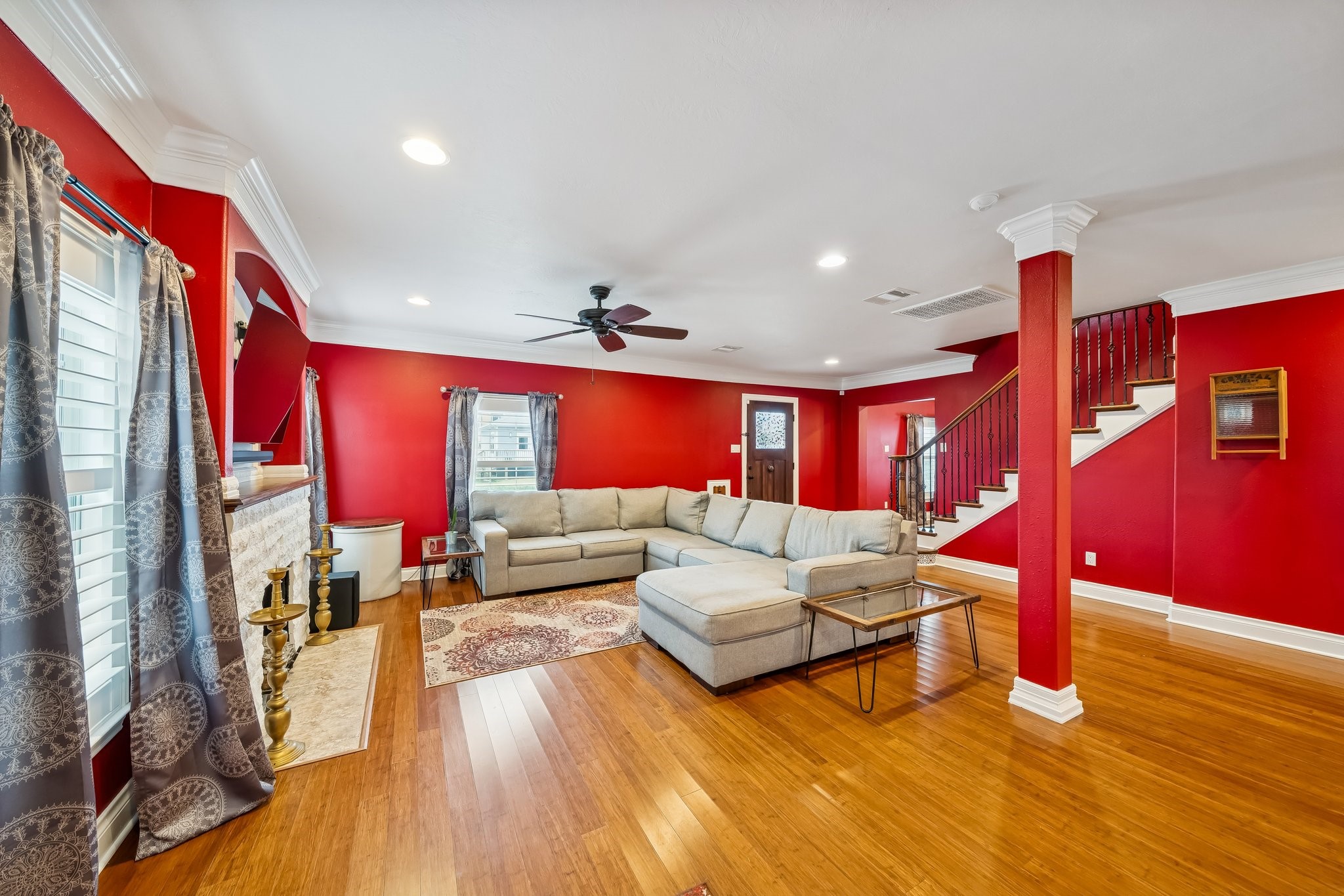 5309 Palmer Street Houston, TX 77004 - Photo 13 of 42 a living room with furniture a rug and a flat screen tv