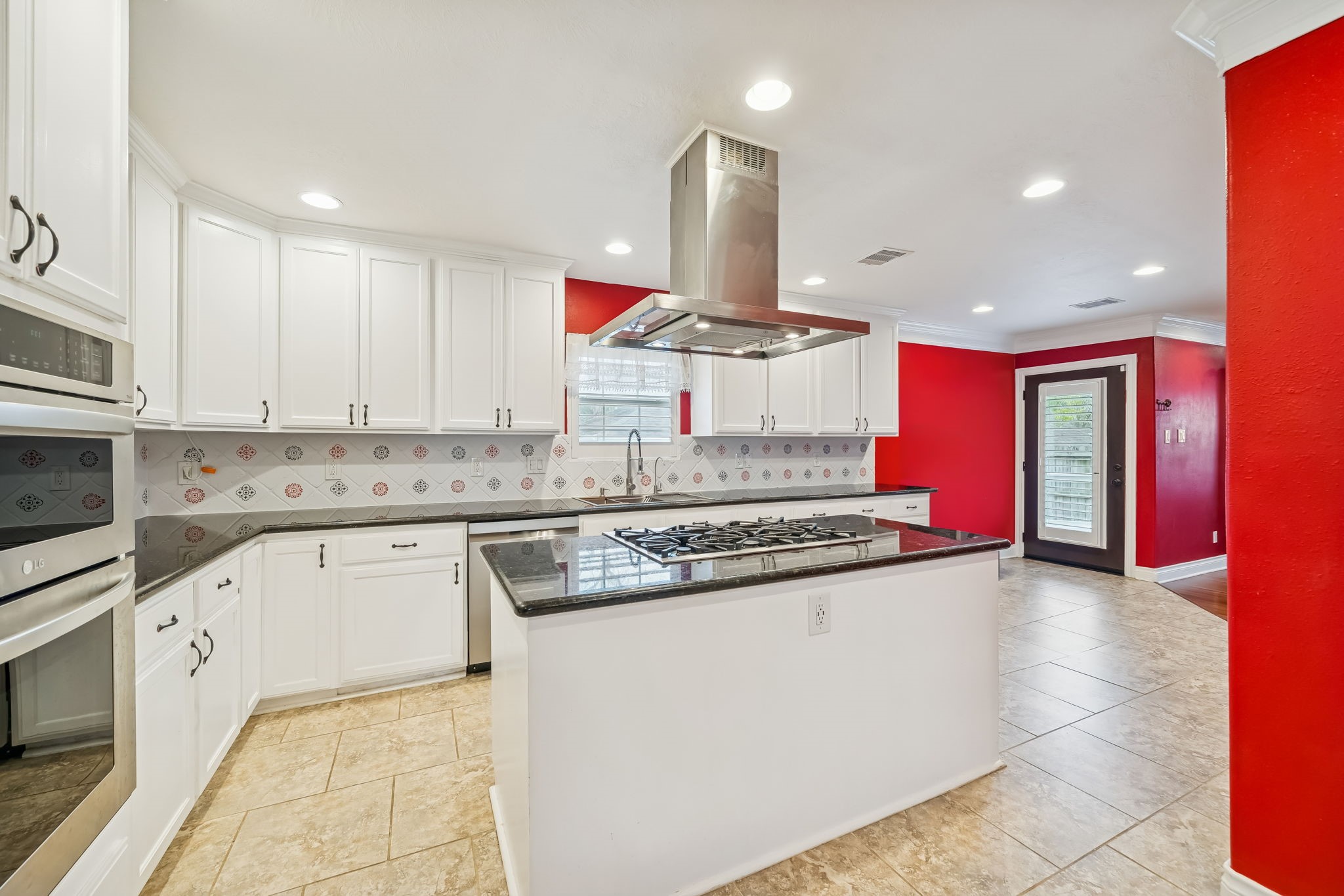 5309 Palmer Street Houston, TX 77004 - Photo 21 of 42 a kitchen with stainless steel appliances granite countertop a stove a sink and a microwave