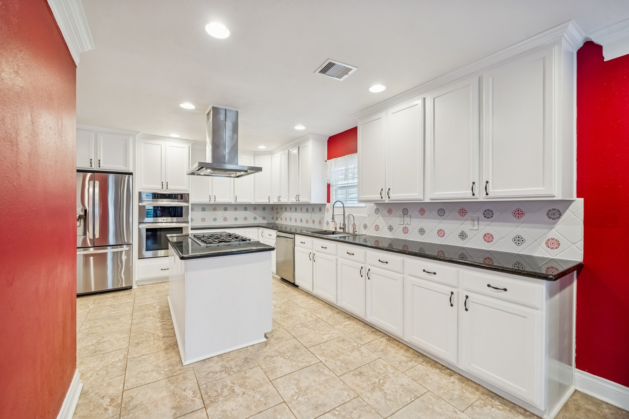 5309 Palmer Street Houston, TX 77004 - Photo 25 of 42 a kitchen with granite countertop white cabinets and white appliances