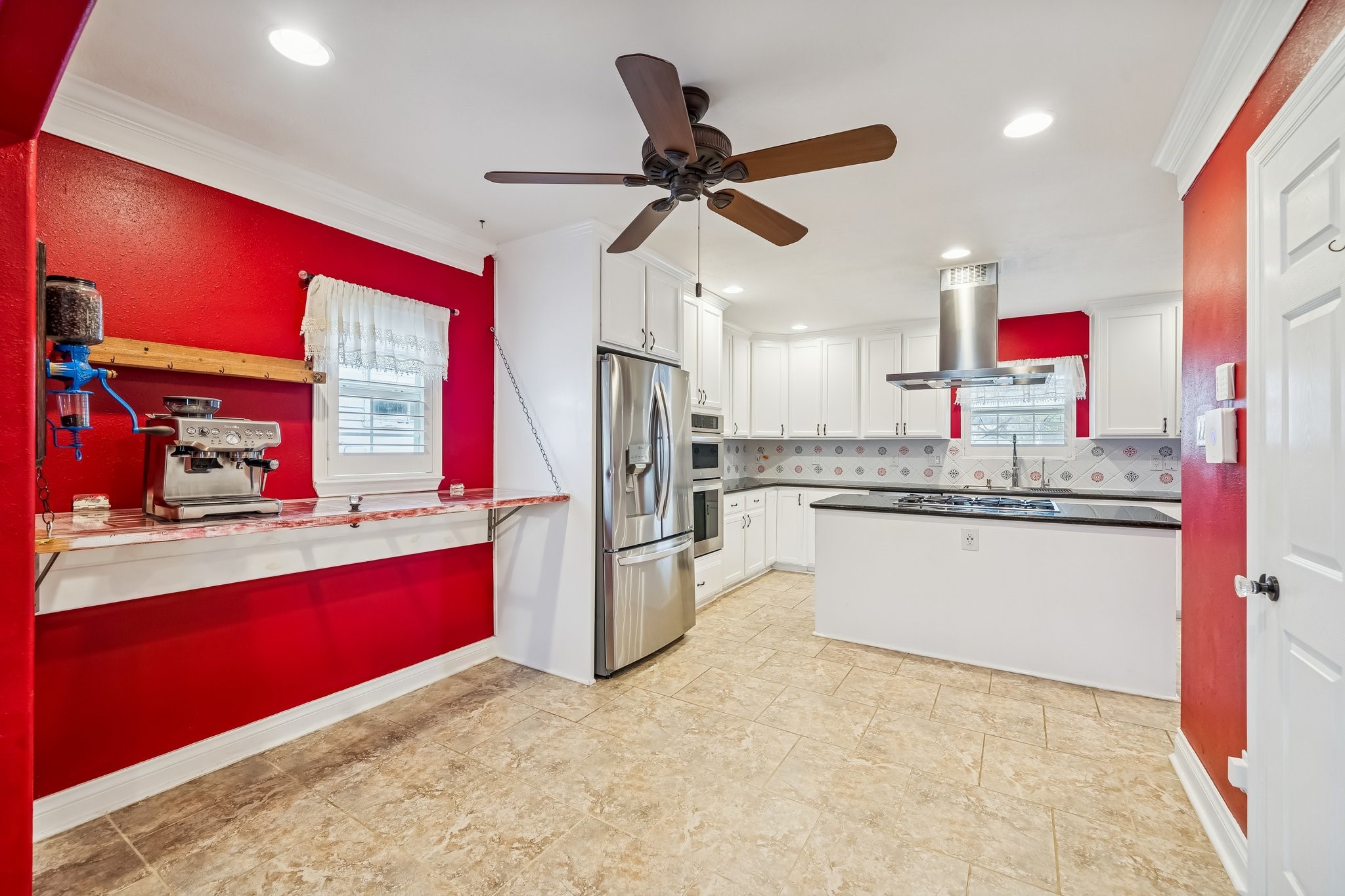 5309 Palmer Street Houston, TX 77004 - Photo 27 of 42 a kitchen with stainless steel appliances granite countertop a sink stove and refrigerator