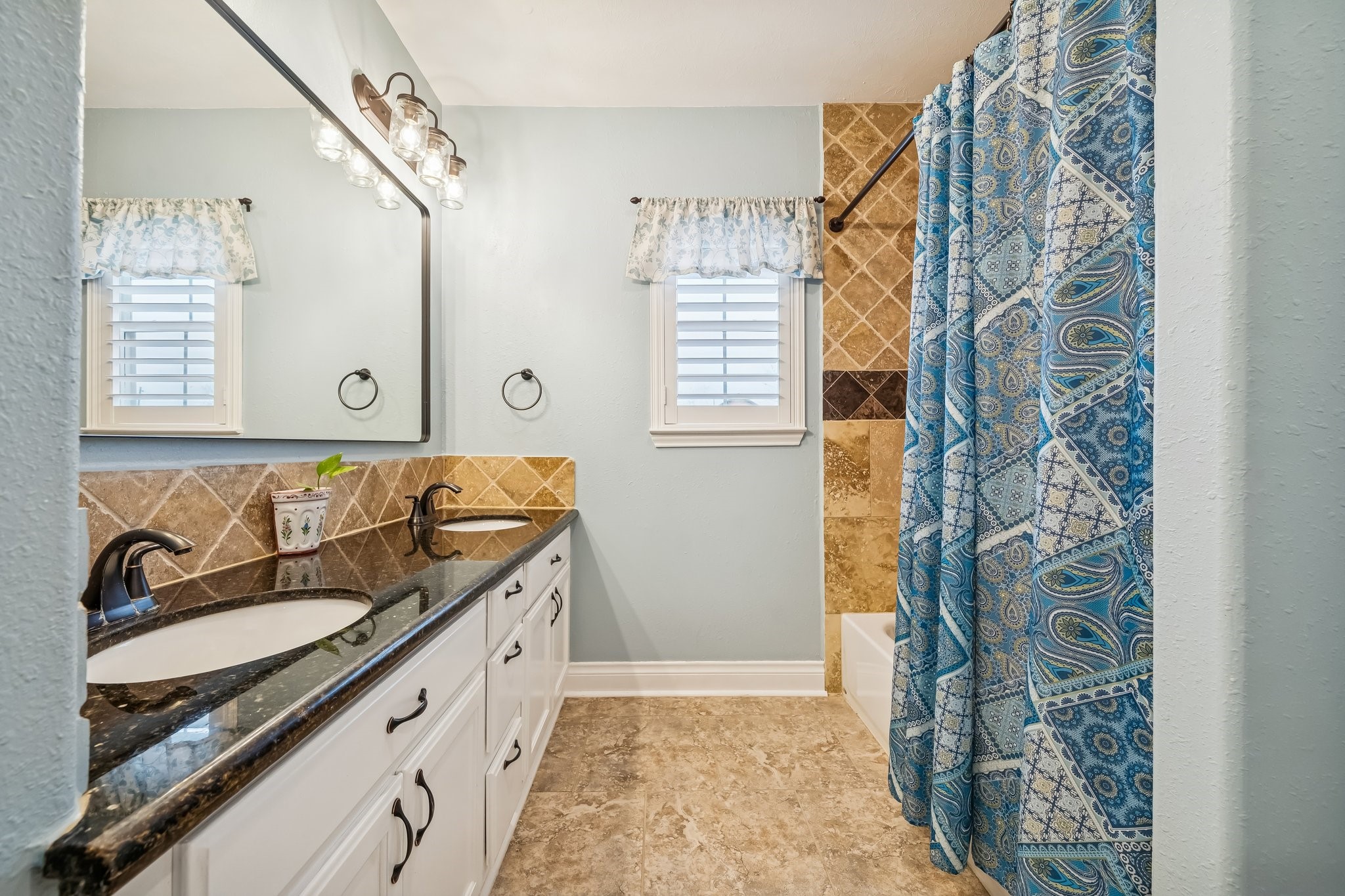 5309 Palmer Street Houston, TX 77004 - Photo 31 of 42 a bathroom with a sink and a mirror
