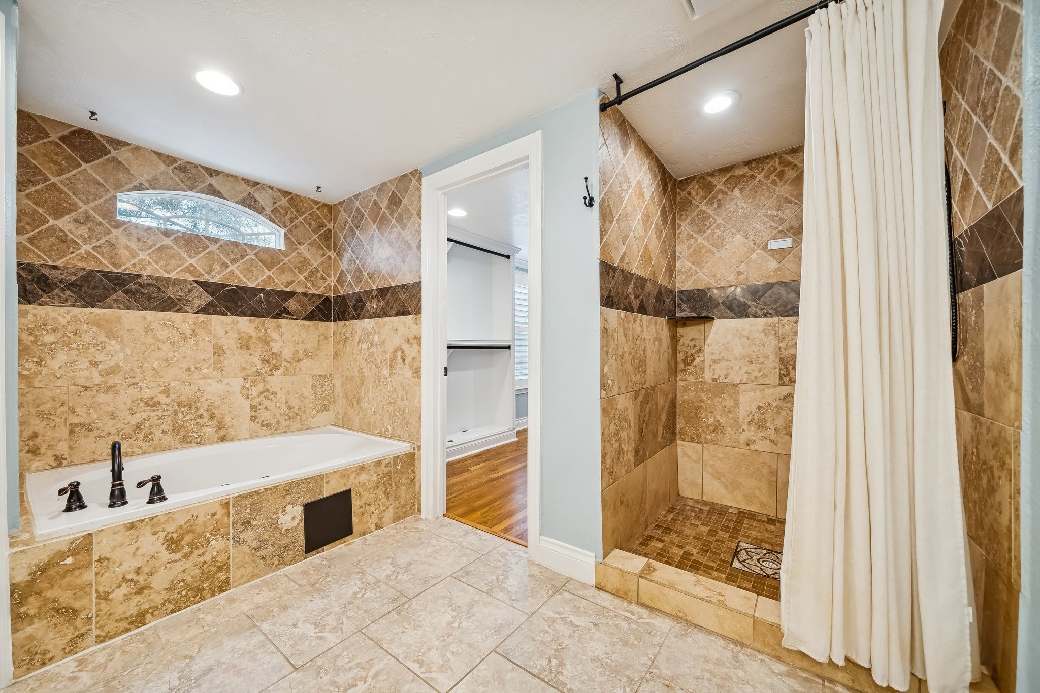 5309 Palmer Street Houston, TX 77004 - Photo 34 of 42 a bathroom with a bathtub and a shower