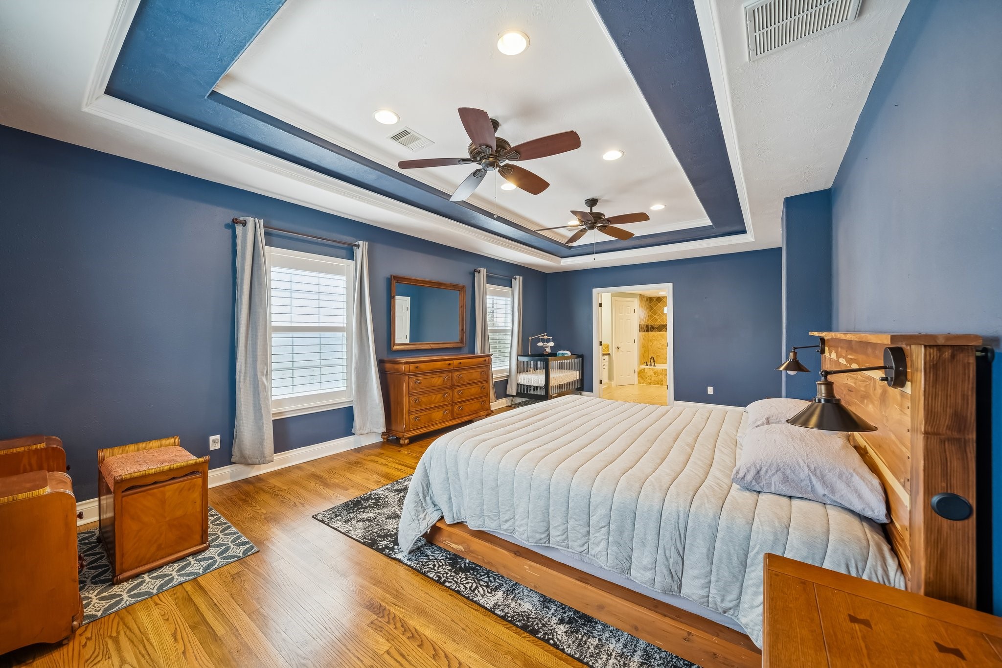 5309 Palmer Street Houston, TX 77004 - Photo 4 of 42 a bedroom with a bed and a chandelier