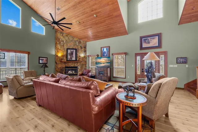 an aerial view of a house with a yard basket ball court and outdoor seating