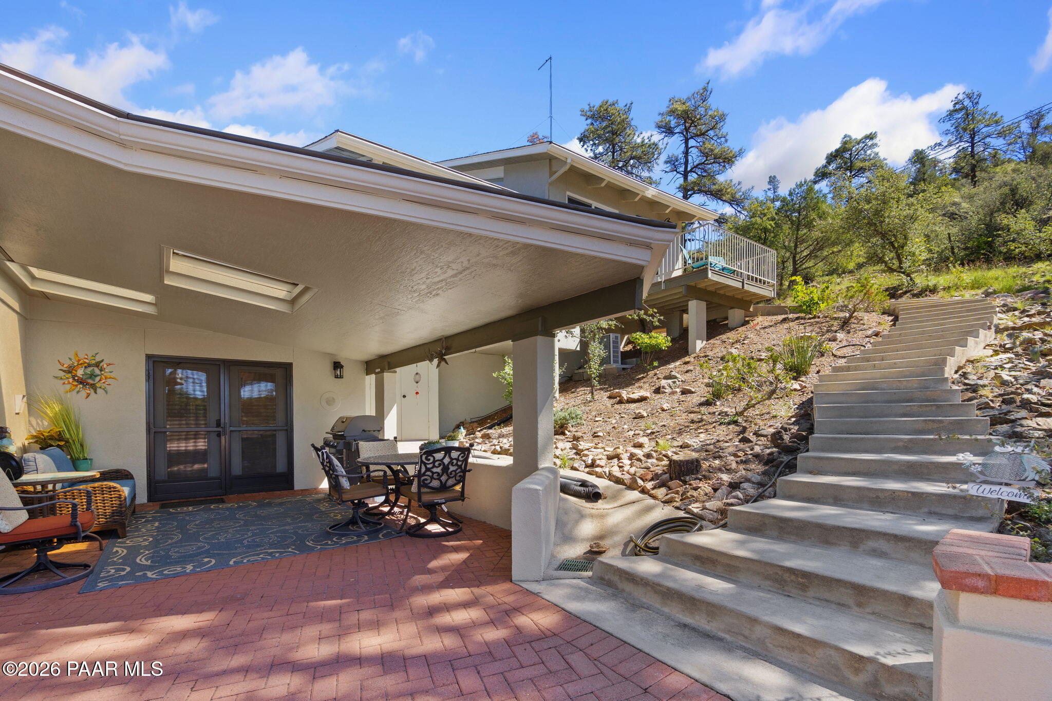 2405 North Williamson Valley Road Prescott, AZ 86305 - Photo 14 of 79 a view of a porch with furniture and a potted plant