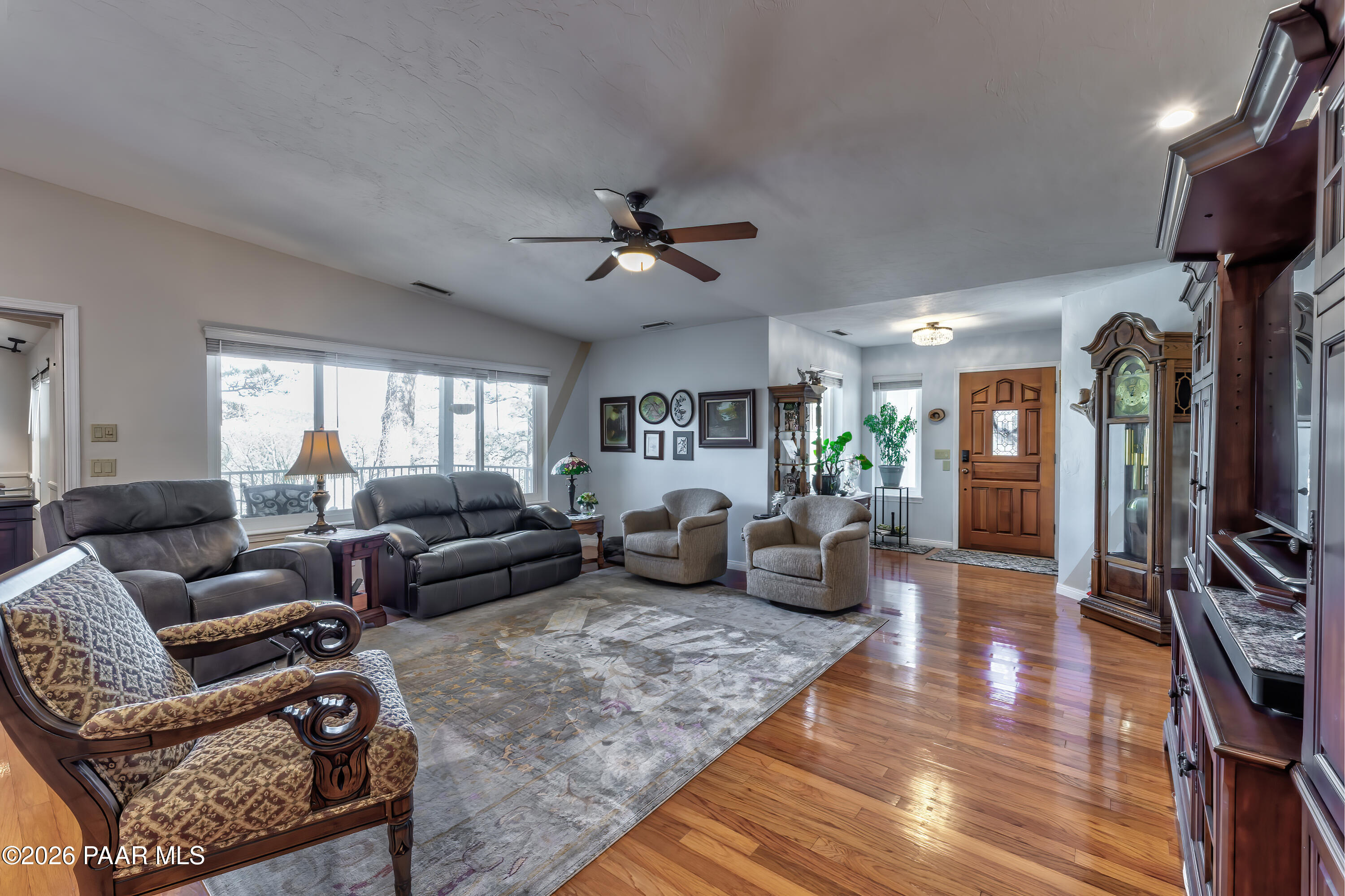 2405 North Williamson Valley Road Prescott, AZ 86305 - Photo 21 of 79 a living room with furniture a ceiling fan and a rug