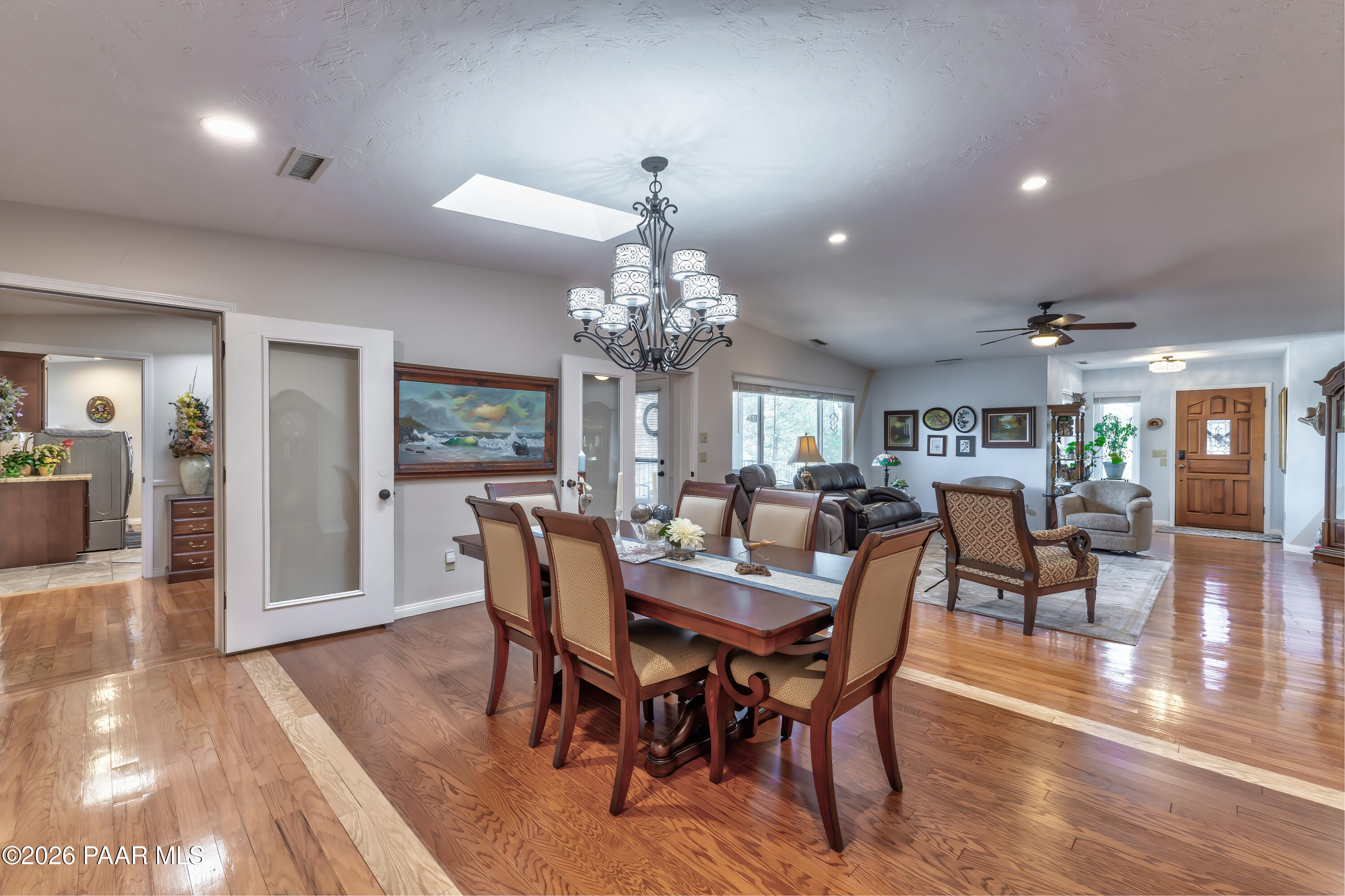 2405 North Williamson Valley Road Prescott, AZ 86305 - Photo 27 of 79 a view of a dining room with furniture wooden floor and chandelier