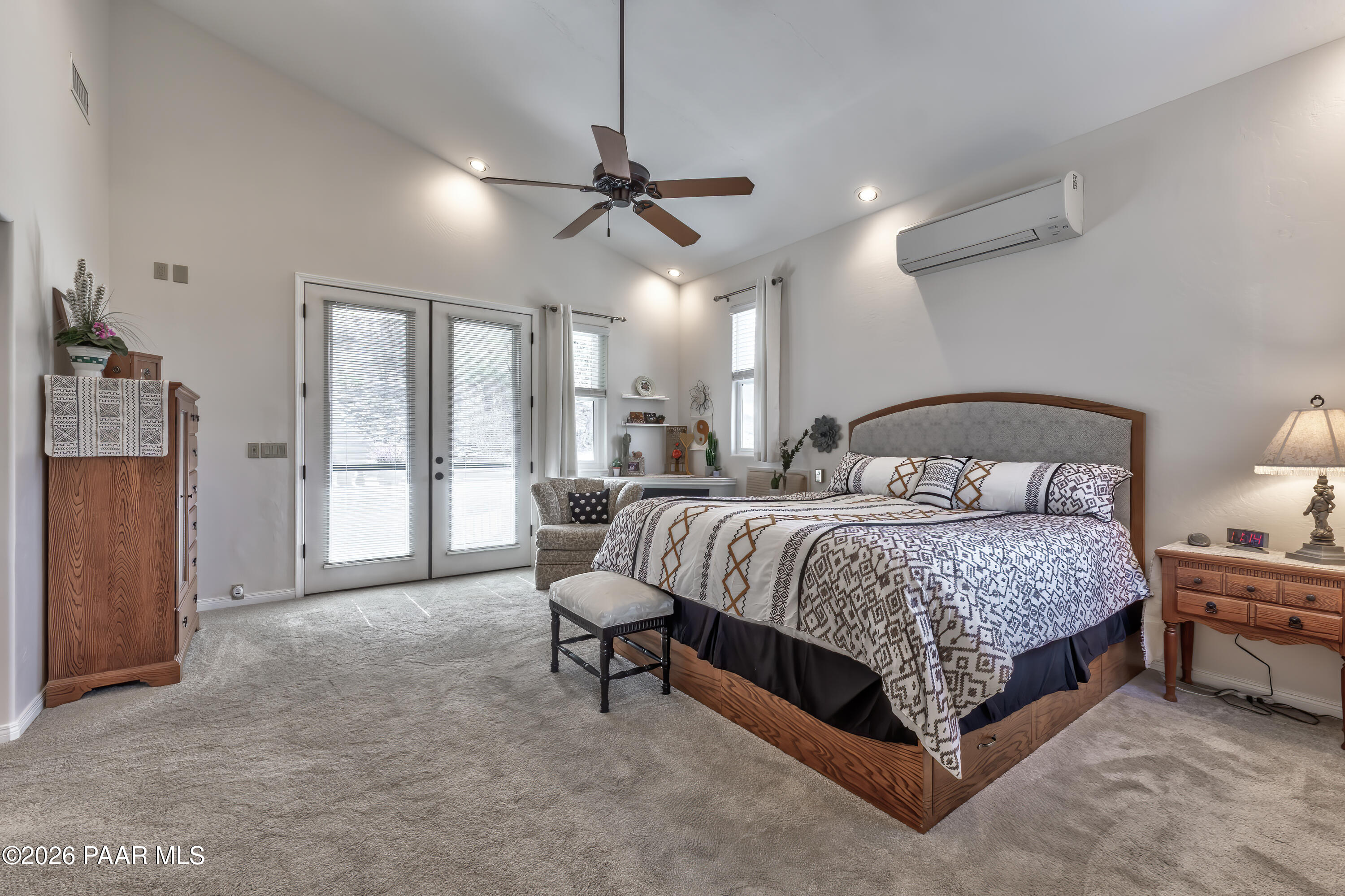 2405 North Williamson Valley Road Prescott, AZ 86305 - Photo 28 of 79 a bedroom with a bed a window and walk in closet