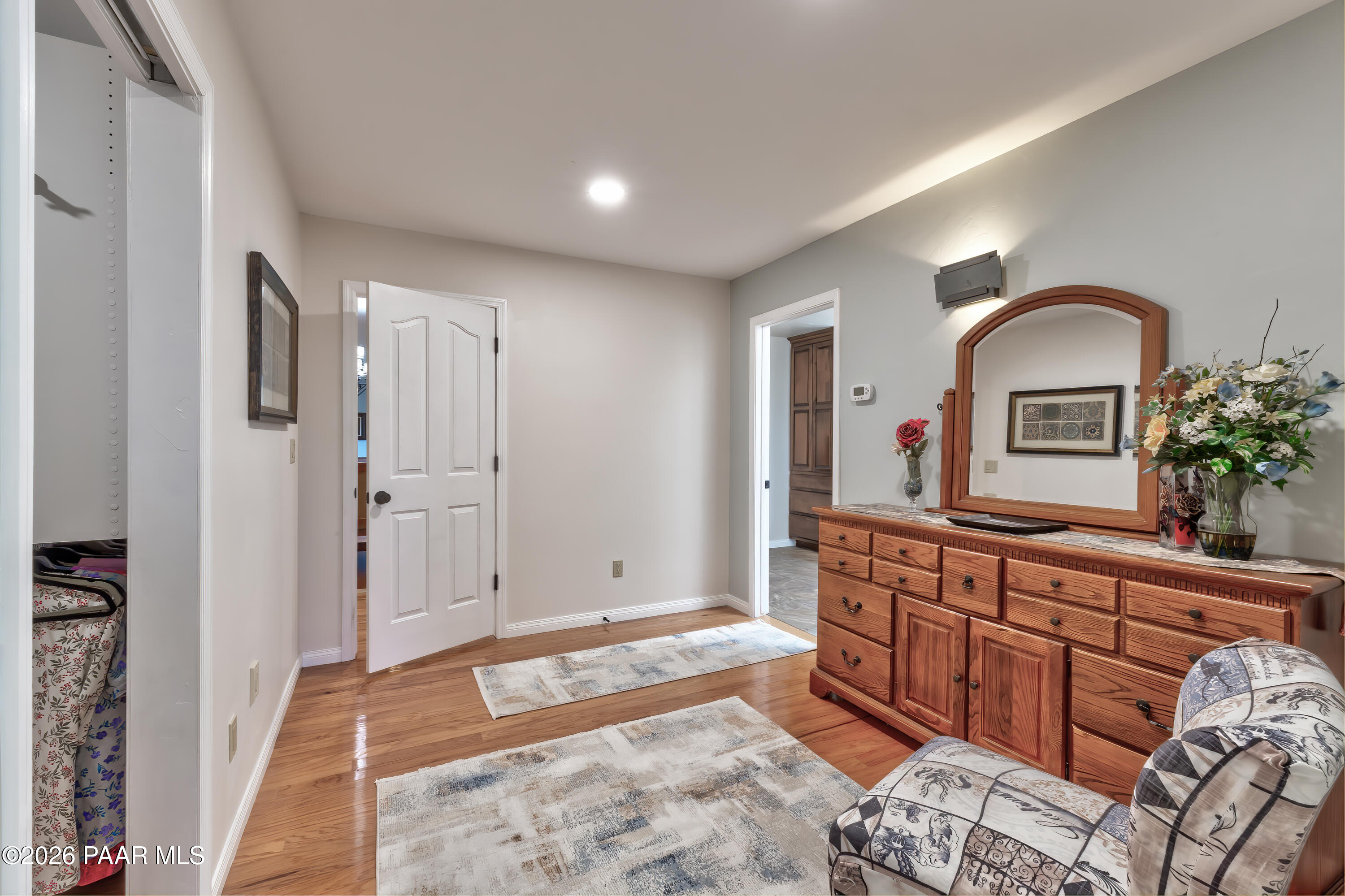 2405 North Williamson Valley Road Prescott, AZ 86305 - Photo 30 of 79 a spacious bedroom with a large bed and a dresser