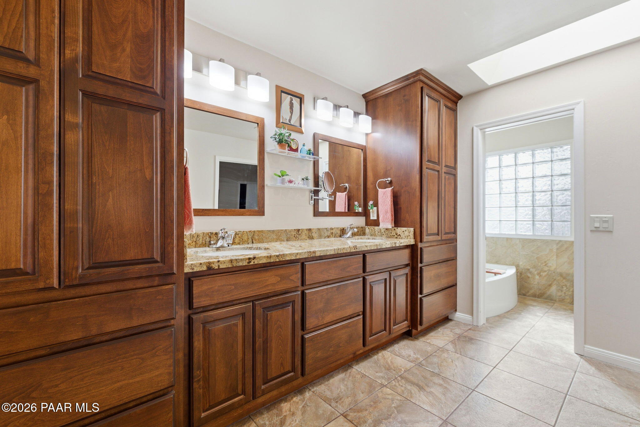 2405 North Williamson Valley Road Prescott, AZ 86305 - Photo 34 of 79 a spacious bathroom with a granite countertop toilet sink and mirror