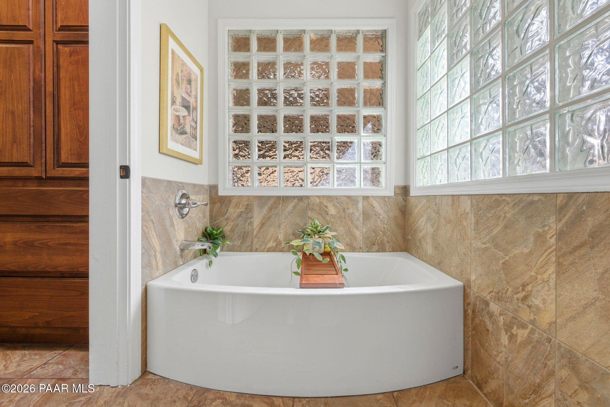 2405 North Williamson Valley Road Prescott, AZ 86305 - Photo 35 of 79 a white bath tub sitting in a bathroom next to a window