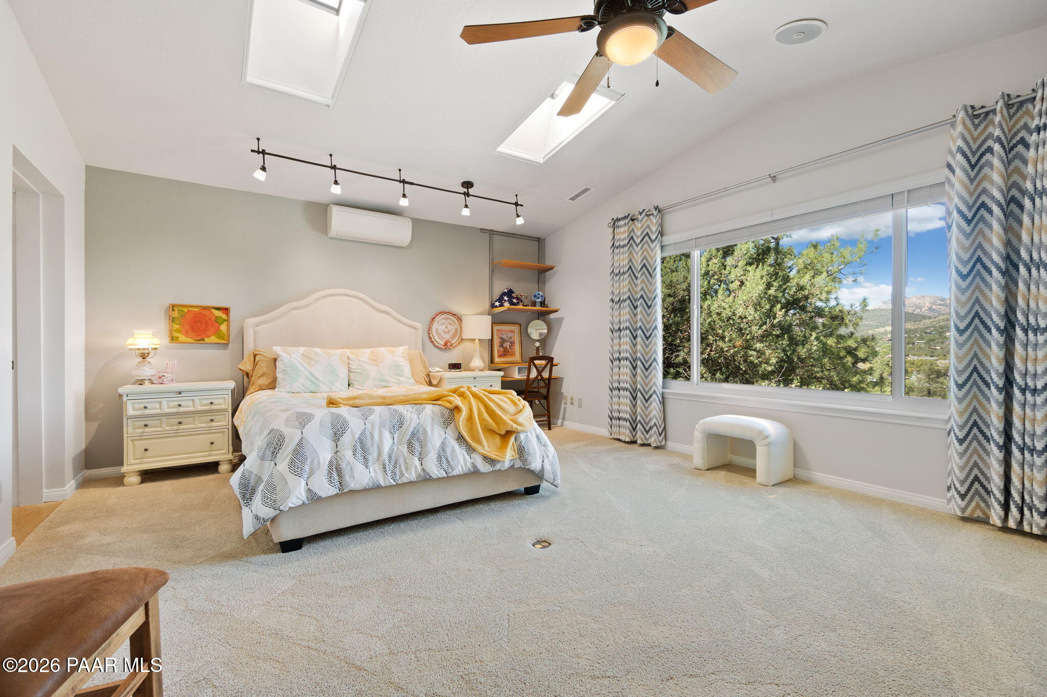 2405 North Williamson Valley Road Prescott, AZ 86305 - Photo 38 of 79 a bedroom with a large bed and windows