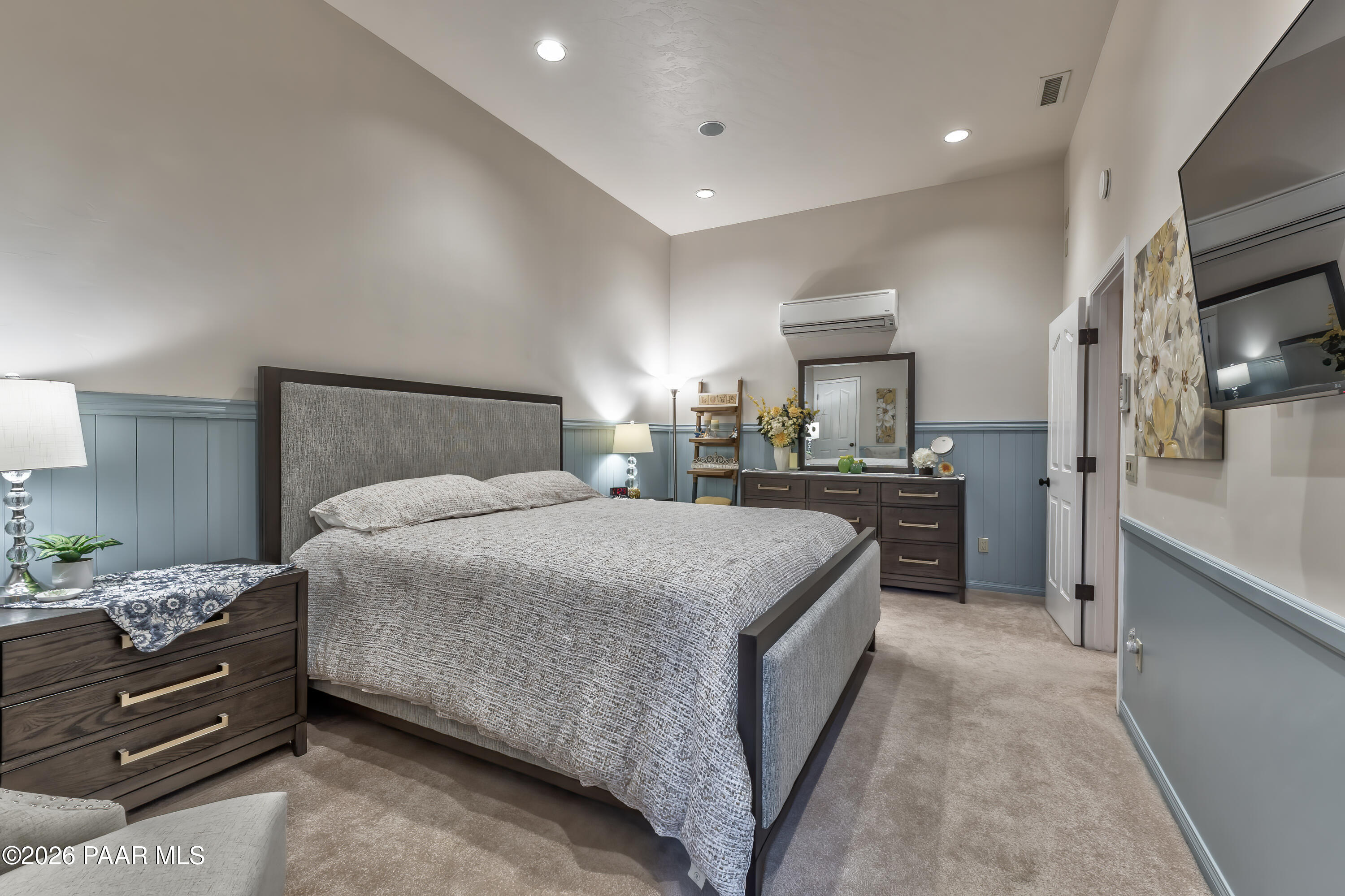 2405 North Williamson Valley Road Prescott, AZ 86305 - Photo 51 of 79 a bedroom with a bed and a large mirror on dresser