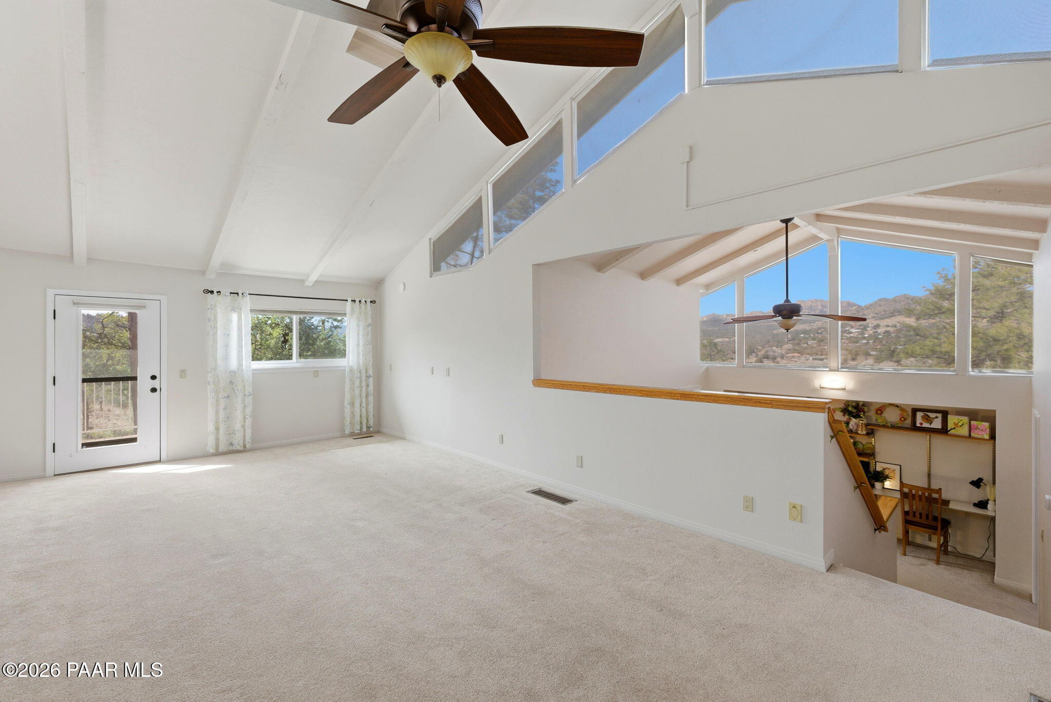 2405 North Williamson Valley Road Prescott, AZ 86305 - Photo 59 of 79 a view of a livingroom with wooden floor and a ceiling fan