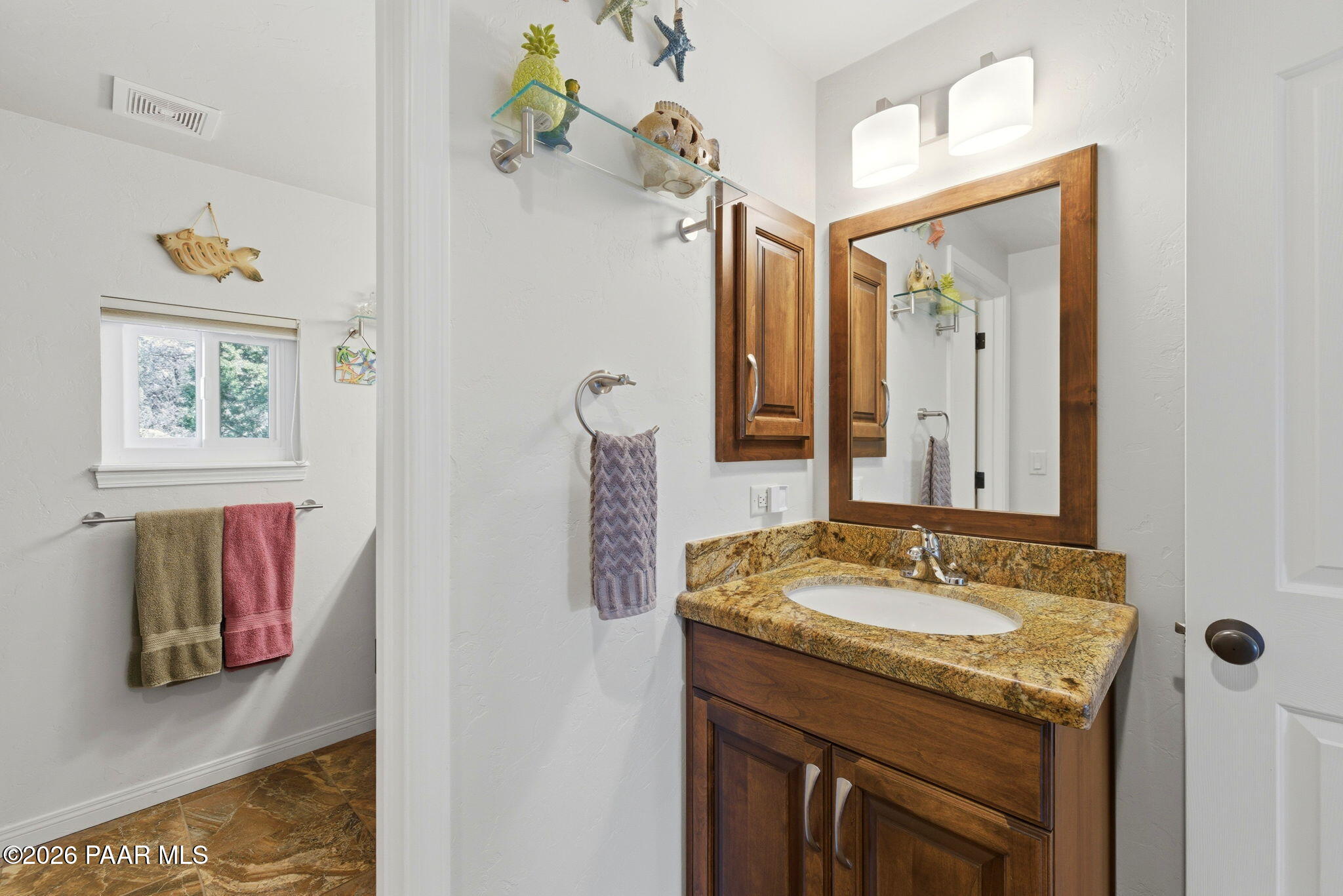 2405 North Williamson Valley Road Prescott, AZ 86305 - Photo 62 of 79 a bathroom with a granite countertop sink and a mirror