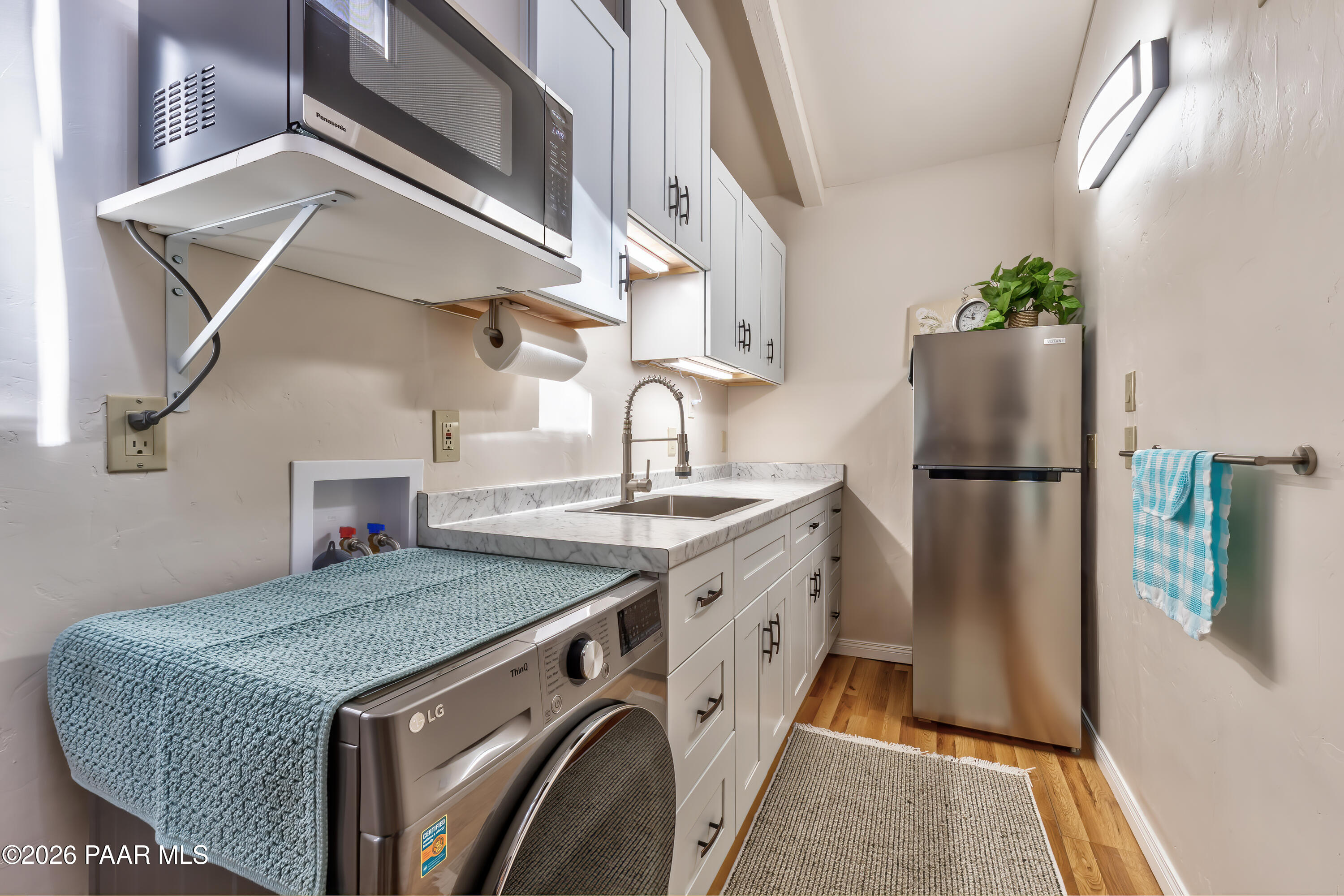 2405 North Williamson Valley Road Prescott, AZ 86305 - Photo 65 of 79 a kitchen with stainless steel appliances granite countertop a refrigerator and a stove