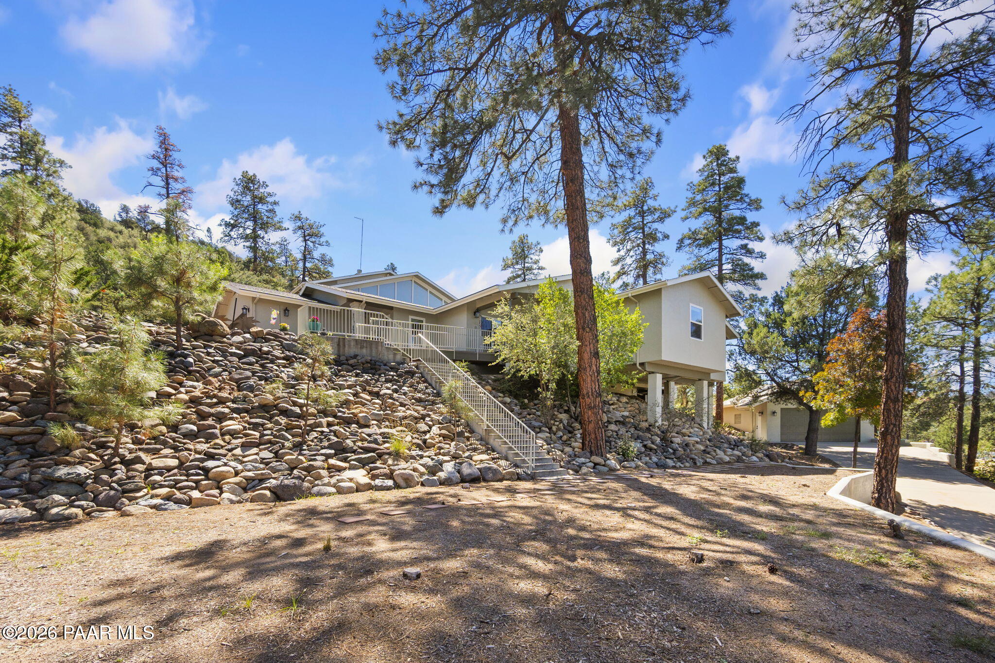 2405 North Williamson Valley Road Prescott, AZ 86305 - Photo 73 of 79 a front view of a house with a yard and garage