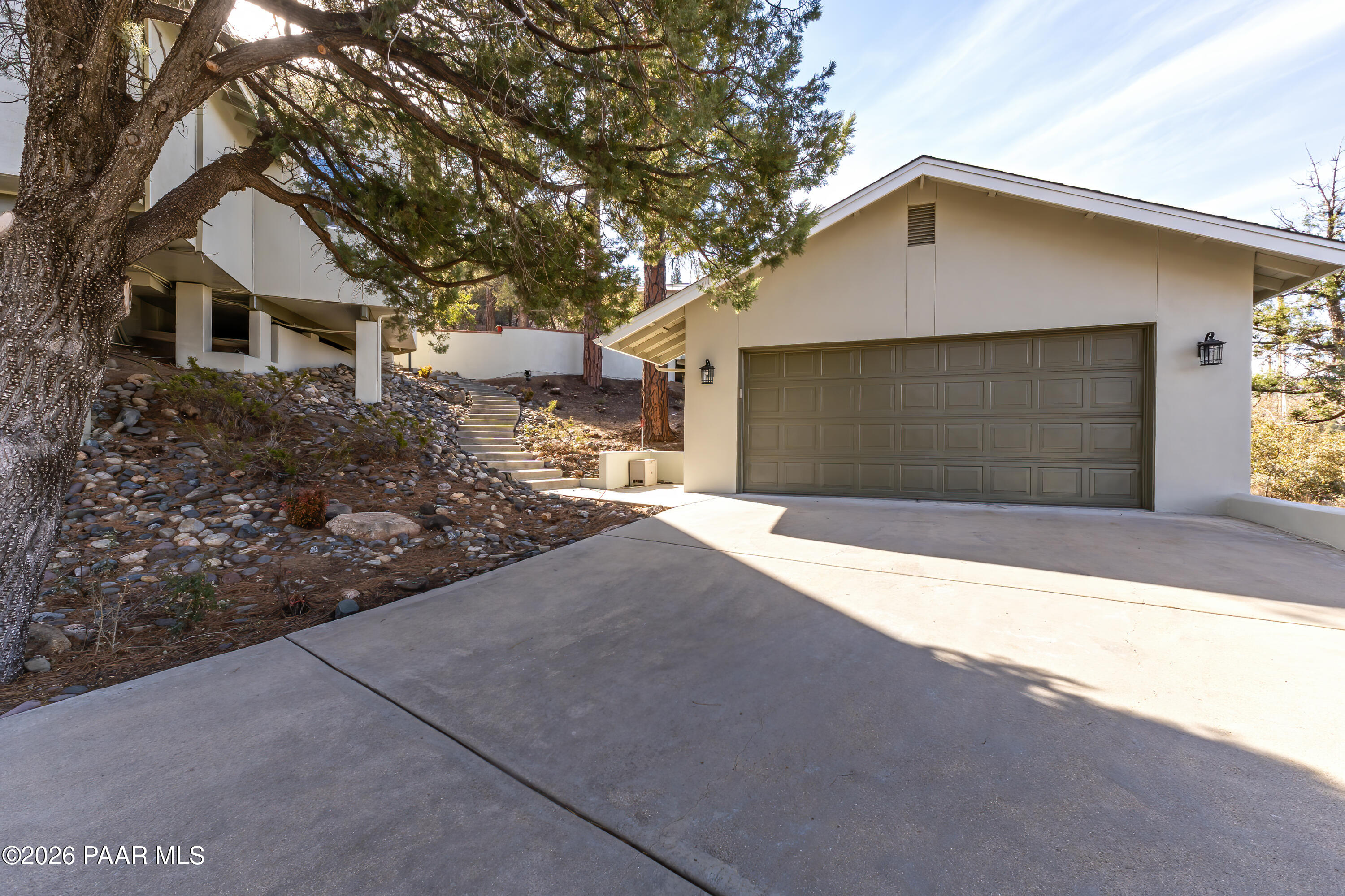 2405 North Williamson Valley Road Prescott, AZ 86305 - Photo 10 of 79 a front view of a house with a yard and garage