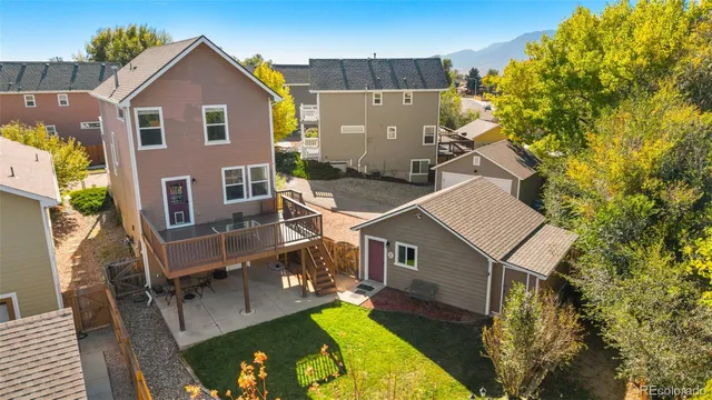a aerial view of a house with swimming pool and porch