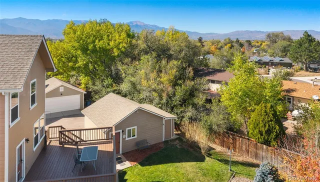 a view of a house with a yard from a balcony