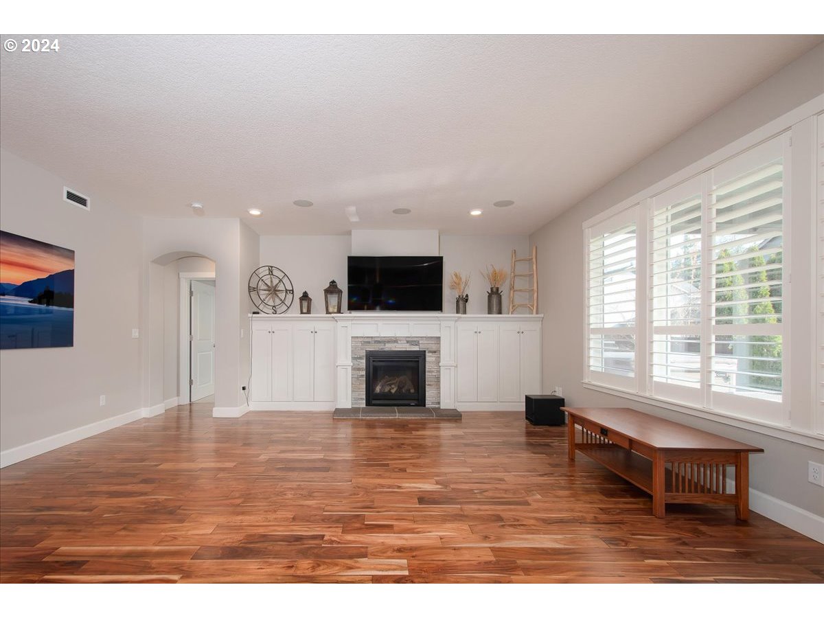 756 North 47th Avenue Ridgefield, WA 98642 - Photo 16 of 42 a living room with furniture and a fireplace