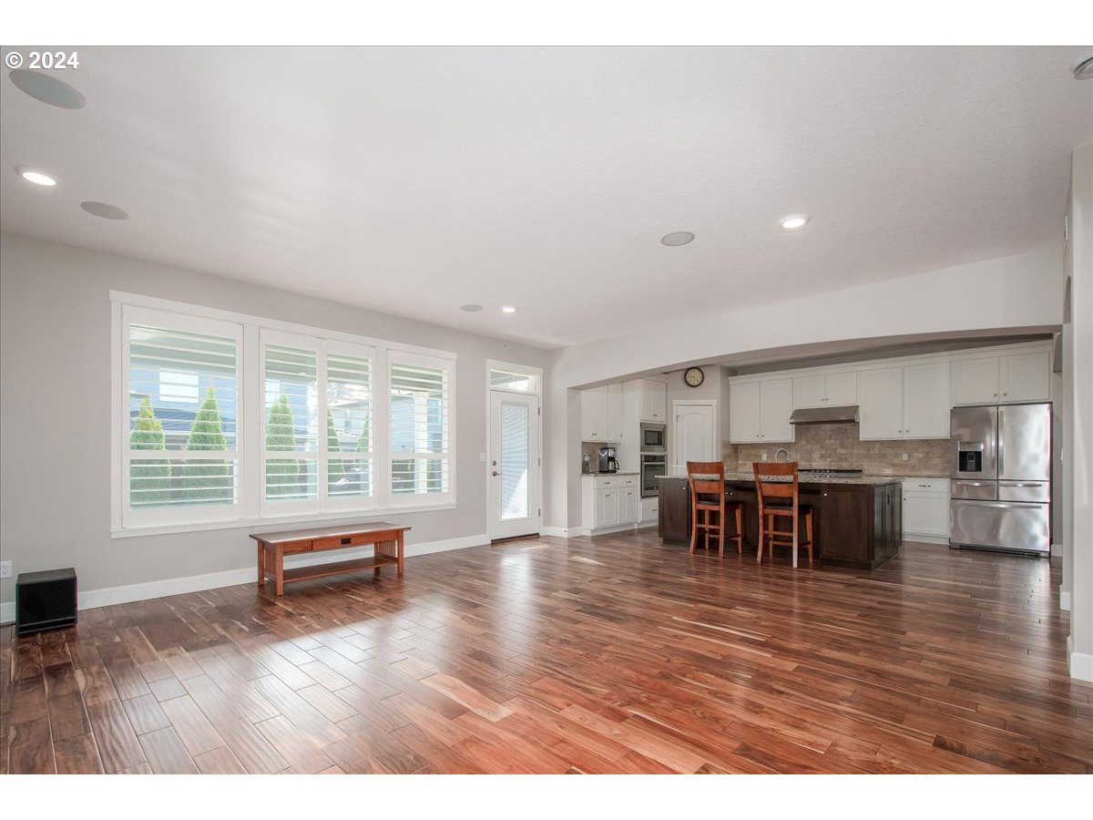 756 North 47th Avenue Ridgefield, WA 98642 - Photo 18 of 42 a living room with furniture and wooden floor