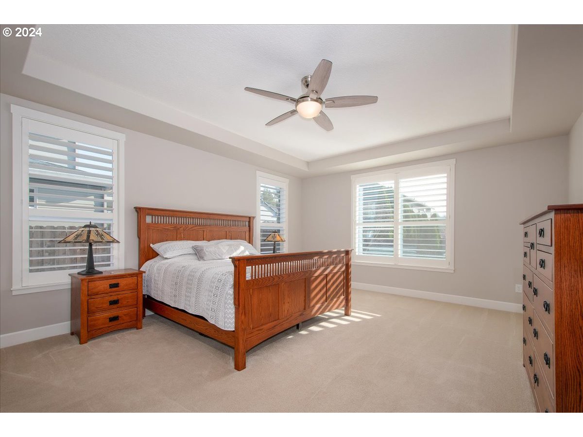 756 North 47th Avenue Ridgefield, WA 98642 - Photo 21 of 42 a bedroom with a bed dresser and a window