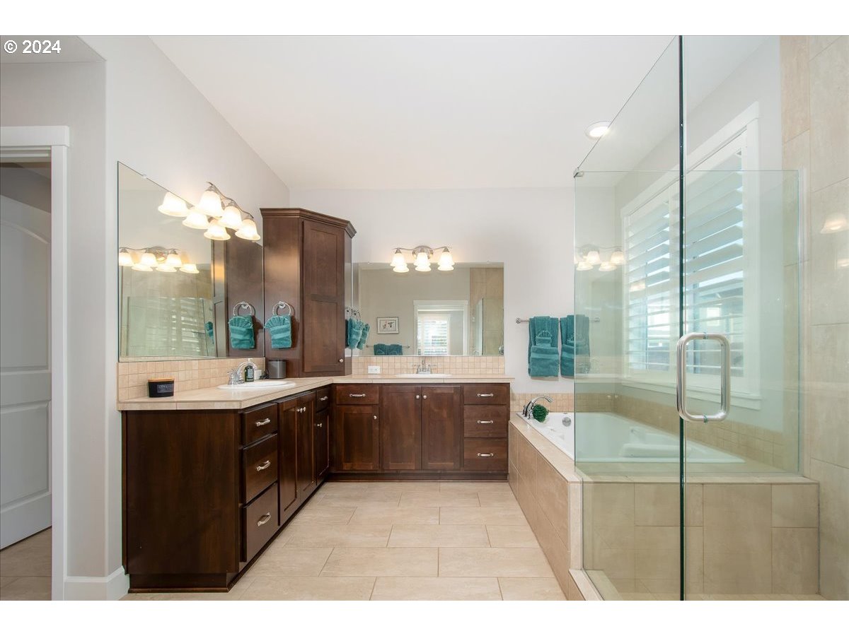 756 North 47th Avenue Ridgefield, WA 98642 - Photo 23 of 42 a large bathroom with a large tub and sink