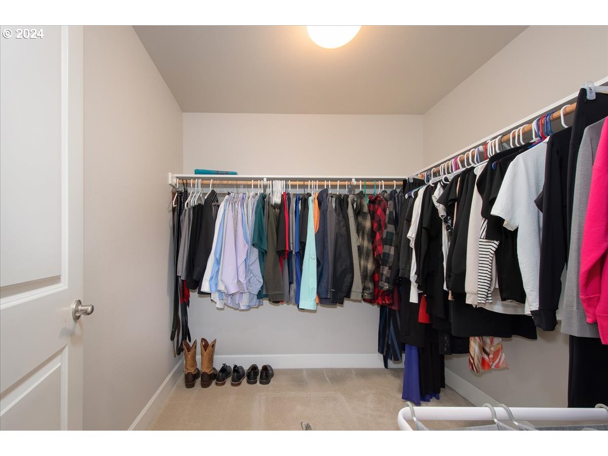 756 North 47th Avenue Ridgefield, WA 98642 - Photo 25 of 42 a view of walk in closet with clothes