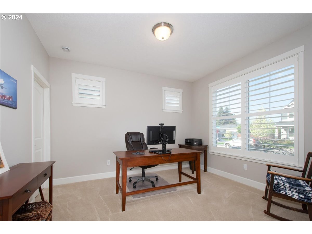756 North 47th Avenue Ridgefield, WA 98642 - Photo 26 of 42 a view of a workspace with furniture and a window