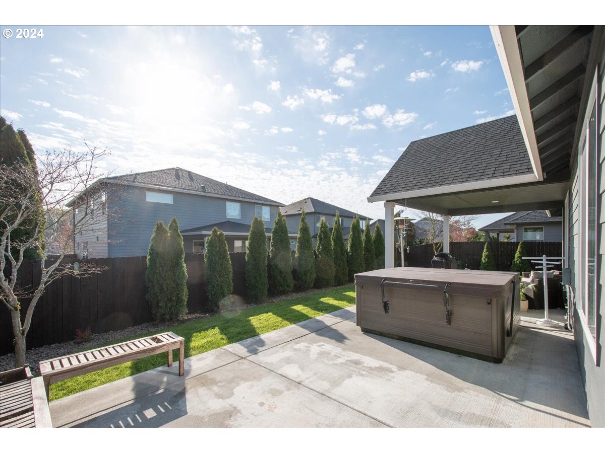 756 North 47th Avenue Ridgefield, WA 98642 - Photo 38 of 42 a backyard of a house with fountain table and chairs