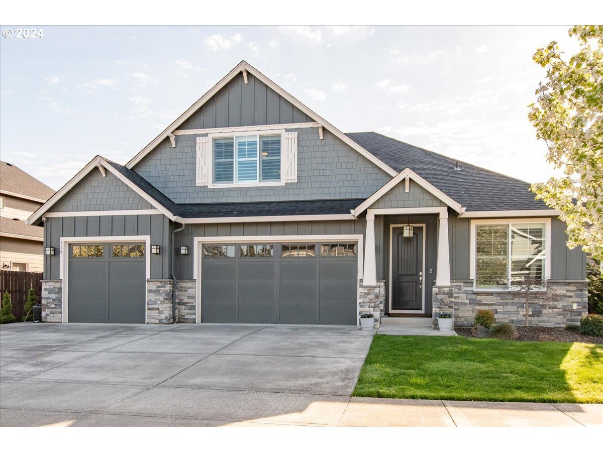 756 North 47th Avenue Ridgefield, WA 98642 - Photo 40 of 42 a front view of a house with a yard