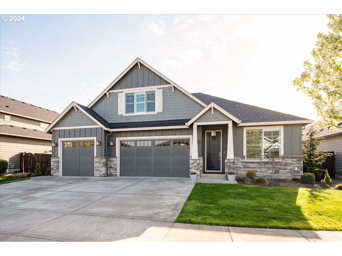 756 North 47th Avenue Ridgefield, WA 98642 - Photo 42 of 42 a front view of a house with a yard and garage