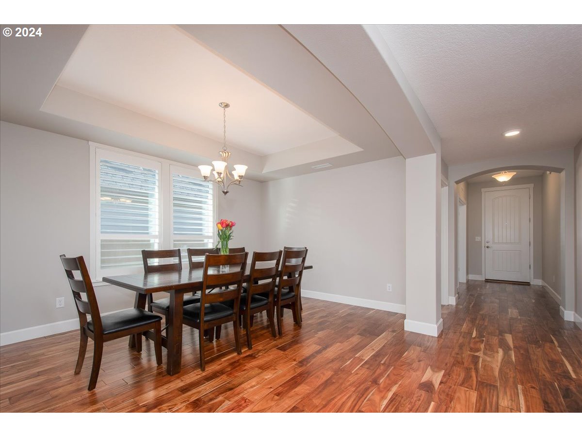756 North 47th Avenue Ridgefield, WA 98642 - Photo 5 of 42 a view of a dining room with furniture and window