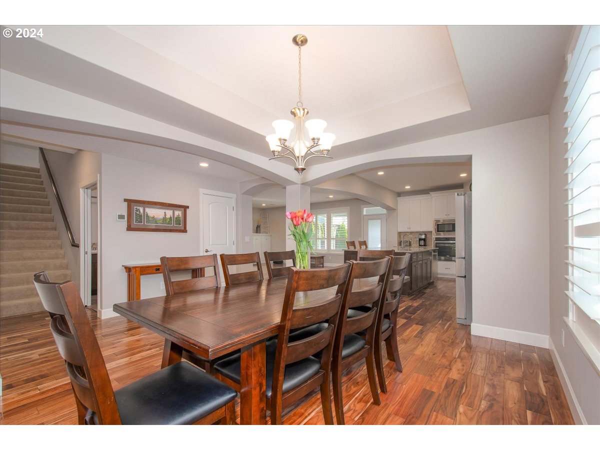 756 North 47th Avenue Ridgefield, WA 98642 - Photo 7 of 42 a view of a dining room with furniture and chandelier