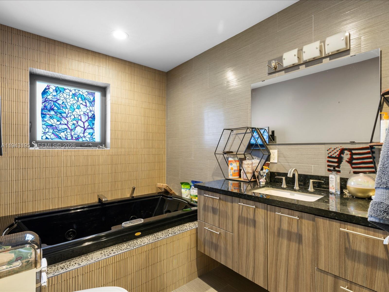 8840 Southwest 50th Terrace Miami, FL 33165 - Photo 11 of 20 a room with stainless steel appliances kitchen island a large stove a sink and a microwave