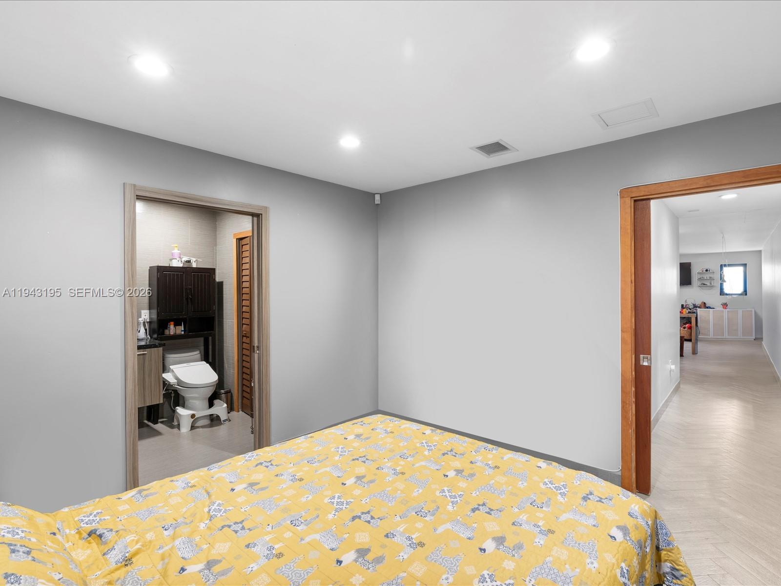 8840 Southwest 50th Terrace Miami, FL 33165 - Photo 12 of 20 a bedroom with a bed and table