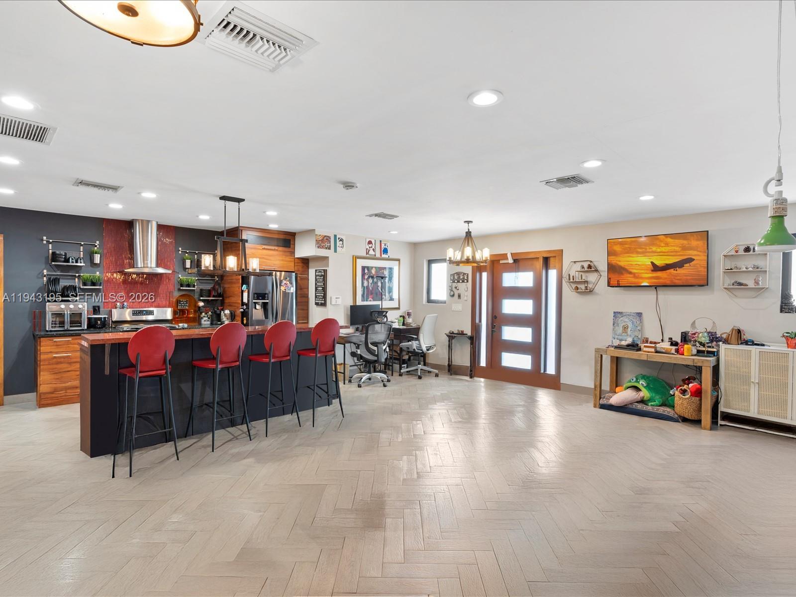8840 Southwest 50th Terrace Miami, FL 33165 - Photo 8 of 20 a living room with lots of furniture and natural light