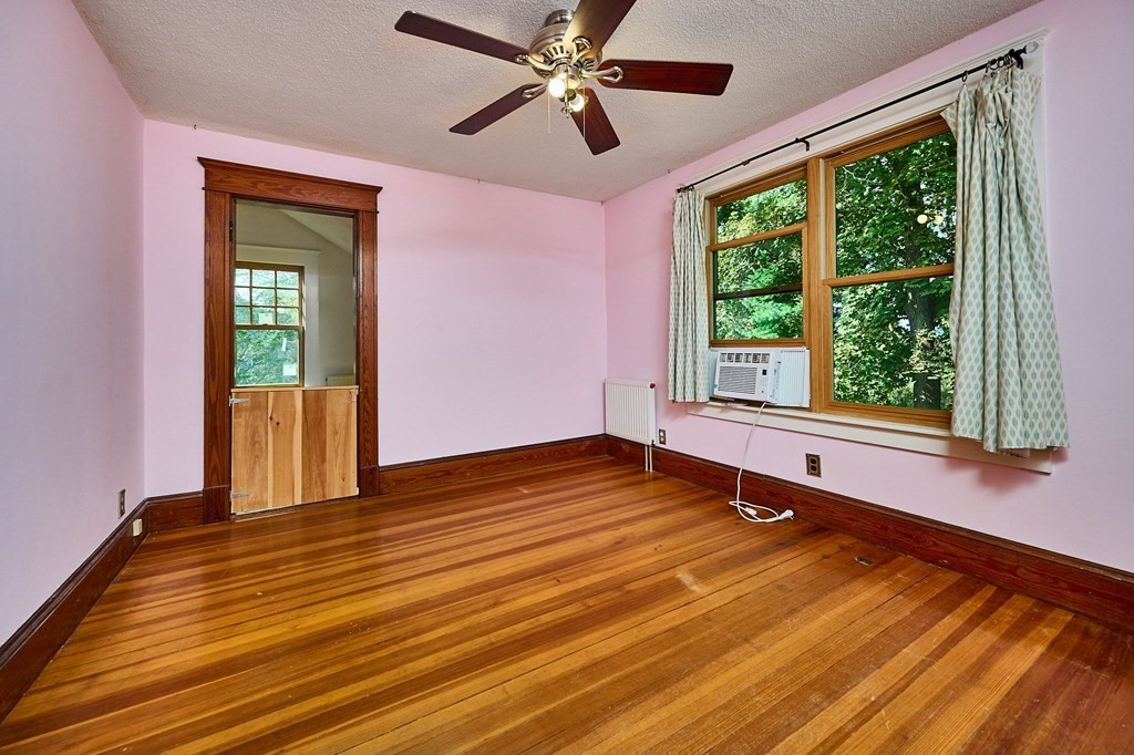 60 Florence Road Easthampton, MA 01027 - Photo 18 of 32 a view of an empty room with a window and wooden floor