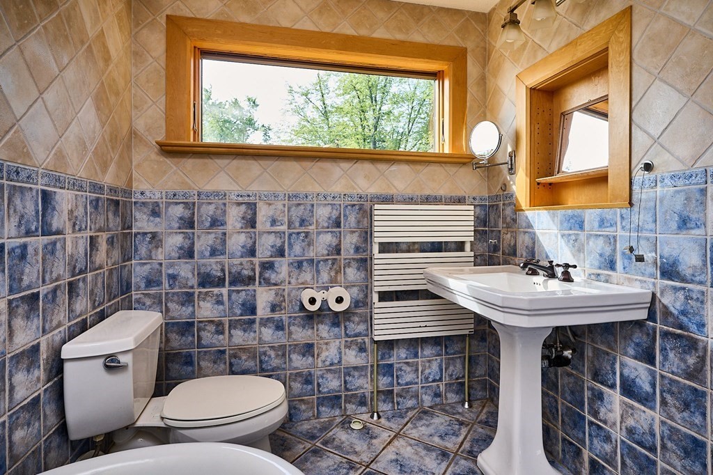 60 Florence Road Easthampton, MA 01027 - Photo 23 of 32 a bathroom with a sink a toilet and mirror