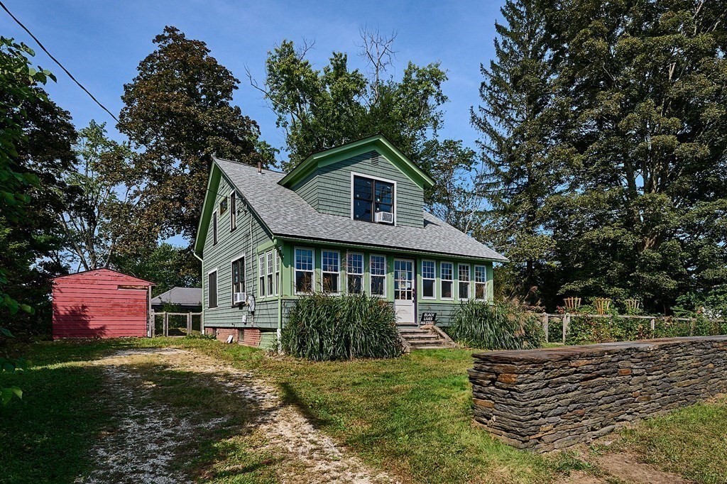 60 Florence Road Easthampton, MA 01027 - Photo 3 of 32 a front view of a house with a yard