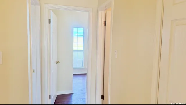 a view of front door with wooden floor