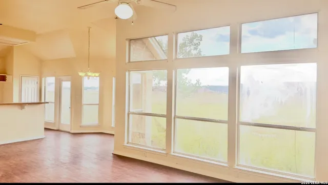 a view of front door with wooden floor