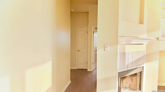 a view of a bathroom from a hallway